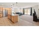 Beautiful kitchen island view with stainless steel appliances with views into living and dining room at 24580 N 144Th Ave, Surprise, AZ 85387