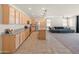 Expansive kitchen offers ample counter space, stainless steel appliances, and opens to a comfortable living area at 24580 N 144Th Ave, Surprise, AZ 85387