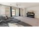 Comfortable living room with a large sectional sofa and sliding glass door access to patio at 24580 N 144Th Ave, Surprise, AZ 85387