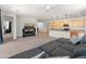 Open-concept living area with view of the kitchen and a comfortable sectional sofa at 24580 N 144Th Ave, Surprise, AZ 85387