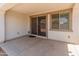 Cozy covered patio with sliding glass doors and a window, perfect for relaxing or entertaining at 24580 N 144Th Ave, Surprise, AZ 85387