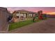The beautiful backyard features a patio, play area, turf, and gravel, great for Gathering fun at 25202 N 106Th Dr, Peoria, AZ 85383