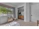 Bright bedroom featuring a window view, bookcase, and access to the closet at 25202 N 106Th Dr, Peoria, AZ 85383