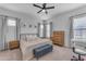 Serene bedroom with a ceiling fan, soft carpeting, and neutral tones for a relaxing ambiance at 25202 N 106Th Dr, Peoria, AZ 85383