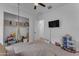 This play room features neutral paint, carpet and light. Note the TV and closet space at 25202 N 106Th Dr, Peoria, AZ 85383