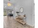 Bright entryway with decorative console table, setting a welcoming tone for the home at 25202 N 106Th Dr, Peoria, AZ 85383