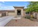 Charming single-story home featuring a desert-scape front yard and covered porch under a beautiful blue sky at 25202 N 106Th Dr, Peoria, AZ 85383