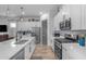 Bright kitchen showcasing white cabinets, stainless steel appliances, and subway tile backsplash at 25202 N 106Th Dr, Peoria, AZ 85383