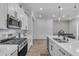 Modern kitchen with stainless steel appliances and a view into the breakfast nook at 25202 N 106Th Dr, Peoria, AZ 85383