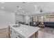 Bright modern kitchen overlooking the living room and breakfast nook with stainless steel appliances at 25202 N 106Th Dr, Peoria, AZ 85383