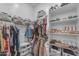 Well-organized walk-in closet with ample shelving and hanging space for clothes and shoe storage at 25202 N 106Th Dr, Peoria, AZ 85383