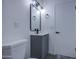 Bathroom featuring a toilet, a sink, and modern lighting at 2833 W Marlette Ave, Phoenix, AZ 85017