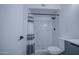 Bathroom featuring a shower with subway tile, a shower curtain, and a toilet at 2833 W Marlette Ave, Phoenix, AZ 85017