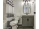 Bathroom with tub, shower with stylish curtain, vanity, and modern fixtures at 2833 W Marlette Ave, Phoenix, AZ 85017