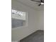 Bedroom with neutral carpet, a ceiling fan, a window, and a closet at 2833 W Marlette Ave, Phoenix, AZ 85017