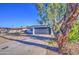 Charming single-story home with a grey garage door and a well-manicured yard at 2833 W Marlette Ave, Phoenix, AZ 85017