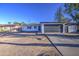 Charming single-story home with a grey garage door and a well-manicured yard at 2833 W Marlette Ave, Phoenix, AZ 85017