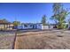 Charming single-story home with a grey garage door and a well-manicured yard at 2833 W Marlette Ave, Phoenix, AZ 85017