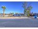 Charming single-story home with a well-manicured yard, beautiful tree, and a spacious driveway at 2833 W Marlette Ave, Phoenix, AZ 85017