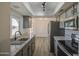 Modern kitchen boasts granite countertops, stainless steel appliances, and ample cabinet space at 2833 W Marlette Ave, Phoenix, AZ 85017