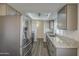 Open kitchen layout with granite countertops, stainless steel appliances, and plenty of storage at 2833 W Marlette Ave, Phoenix, AZ 85017
