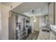 Well-lit kitchen features stainless steel appliances, granite countertops and gray cabinets at 2833 W Marlette Ave, Phoenix, AZ 85017