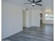 Open-concept living room with sleek ceiling fan seamlessly connecting to the kitchen at 2833 W Marlette Ave, Phoenix, AZ 85017
