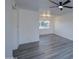Spacious living room with sleek ceiling fan and a stylish light fixture at 2833 W Marlette Ave, Phoenix, AZ 85017