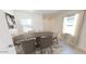 Stylized Dining Room with neutral walls, carpet, large window, table and chairs at 29747 N Oak Dr, Florence, AZ 85132