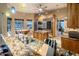Gourmet kitchen with stainless steel appliances, custom cabinets, and a view to the breakfast nook and backyard at 30330 N 77Th Pl, Scottsdale, AZ 85266