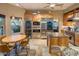 Modern kitchen boasting high-end appliances, granite countertops, and a breakfast nook with natural light at 30330 N 77Th Pl, Scottsdale, AZ 85266