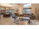 Cozy living area featuring travertine flooring, comfortable seating, and views of the natural landscape at 30330 N 77Th Pl, Scottsdale, AZ 85266