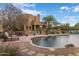 Backyard pool with desert landscaping and an outdoor living area at 30330 N 77Th Pl, Scottsdale, AZ 85266