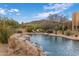 Beautiful backyard pool with waterfall feature and outdoor kitchen at 30330 N 77Th Pl, Scottsdale, AZ 85266