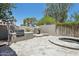 Backyard featuring a pizza oven, grill, and spa at 3202 E Orange Dr, Phoenix, AZ 85018