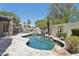 Backyard with a pool, spa, and lush landscaping at 3202 E Orange Dr, Phoenix, AZ 85018
