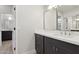 Elegant bathroom featuring a modern vanity with white countertop and contemporary fixtures at 3202 E Orange Dr, Phoenix, AZ 85018