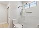 Bathroom featuring a glass shower and a toilet at 3202 E Orange Dr, Phoenix, AZ 85018