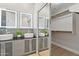 Bathroom with double sinks with lighted mirrors and a walk-in closet at 3202 E Orange Dr, Phoenix, AZ 85018