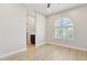 Bright bedroom with a decorative window and ensuite bathroom at 3202 E Orange Dr, Phoenix, AZ 85018