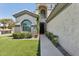 Welcoming home entrance featuring manicured landscaping and a well-lit pathway to the front door at 3202 E Orange Dr, Phoenix, AZ 85018