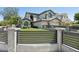 Stunning two-story home boasting an impeccable lawn and elegant horizontal fence at 3202 E Orange Dr, Phoenix, AZ 85018