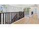 Bright hallway with wood floors and views of the exterior at 3202 E Orange Dr, Phoenix, AZ 85018