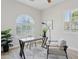 Bright home office featuring a modern desk, large windows with shutters, and neutral decor at 3202 E Orange Dr, Phoenix, AZ 85018