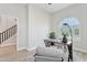 Calm home office with a gray desk, an arched window with plantation shutters, and minimalist decor at 3202 E Orange Dr, Phoenix, AZ 85018