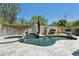 Backyard pool with a spa and desert landscaping at 3202 E Orange Dr, Phoenix, AZ 85018