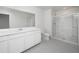 Bright bathroom features a large vanity with ample storage and a glass-enclosed shower for a clean, modern feel at 32202 N Knauss Ln, San Tan Valley, AZ 85143
