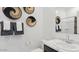 Clean bathroom with a white marble countertop, modern fixtures, and decorative woven baskets at 35556 N Common Ct, San Tan Valley, AZ 85140
