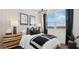 Stylish bedroom with modern lighting, patterned wallpaper, and a cozy, inviting bed at 35556 N Common Ct, San Tan Valley, AZ 85140