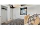 Inviting bedroom featuring stylish decor, patterned bedding, and ample closet space at 35556 N Common Ct, San Tan Valley, AZ 85140